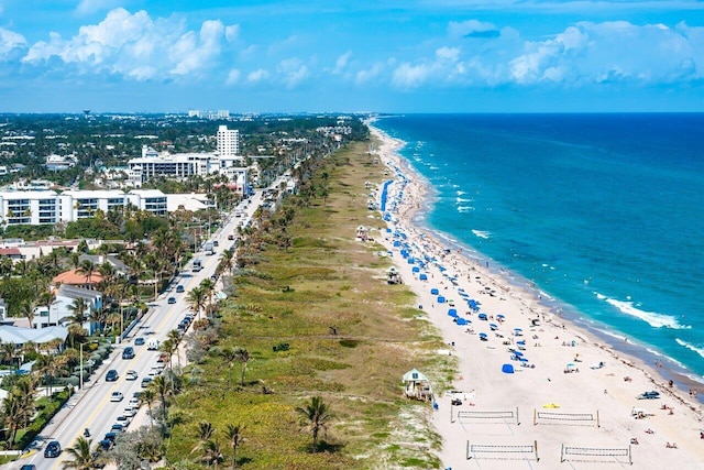 bird's eye view with a water view and a view of the beach