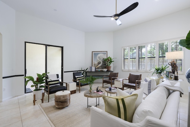 living room featuring ceiling fan and light tile patterned floors