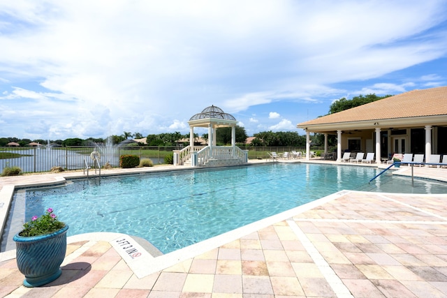 view of swimming pool with a gazebo and a patio area