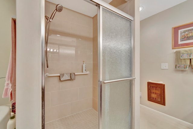 bathroom featuring tile patterned flooring and a shower with door