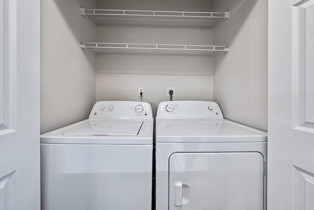 washroom with independent washer and dryer