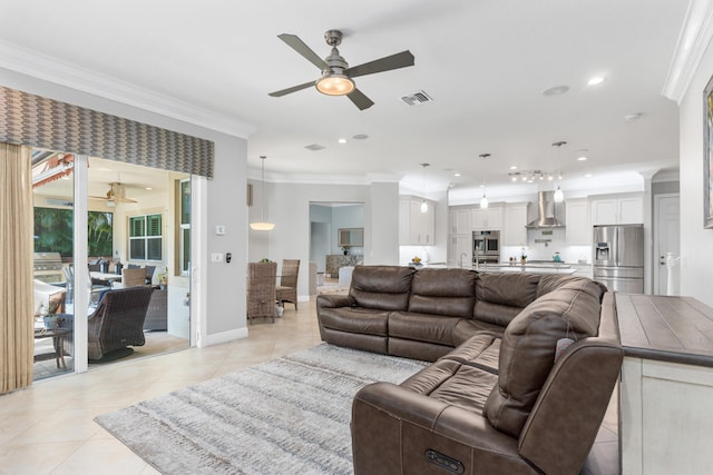 living room featuring light tile patterned flooring, ornamental molding, and ceiling fan