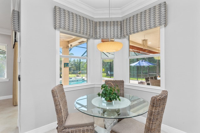 dining area with crown molding