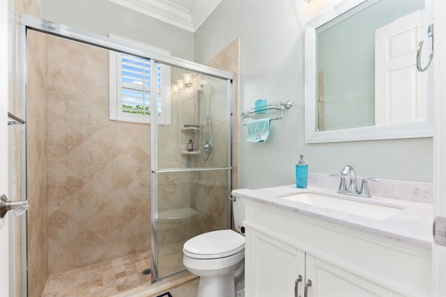 bathroom with an enclosed shower, ornamental molding, vanity, and toilet