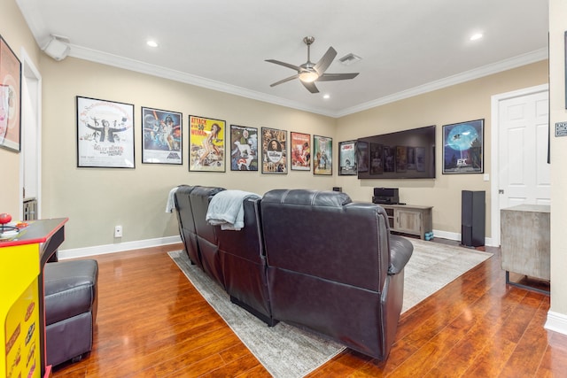 living room with ornamental molding, ceiling fan, and dark wood-type flooring