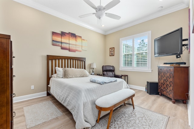 bedroom with light hardwood / wood-style floors, ornamental molding, and ceiling fan