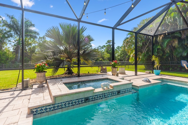 view of pool featuring an in ground hot tub, glass enclosure, a patio, and a lawn