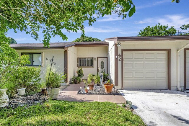 ranch-style house featuring a garage