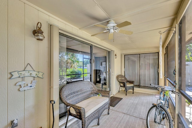 sunroom with a ceiling fan