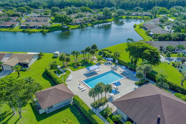 drone / aerial view with a water view and a residential view