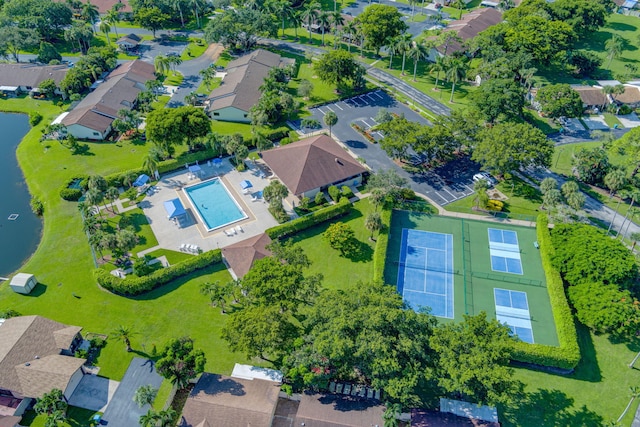 birds eye view of property with a residential view and a water view