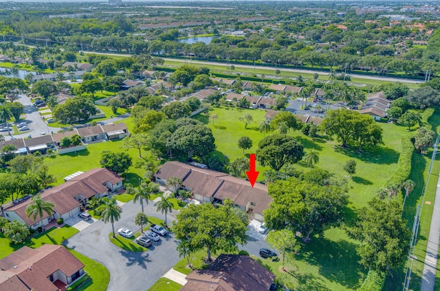 drone / aerial view featuring a residential view and a water view