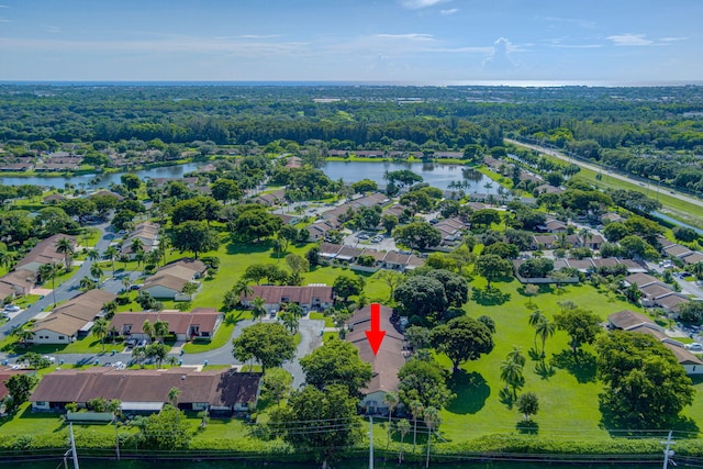 birds eye view of property featuring a residential view and a water view