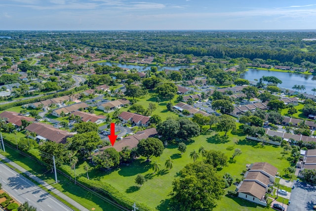 birds eye view of property featuring a residential view and a water view