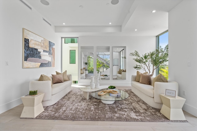 living room featuring expansive windows and light wood-type flooring