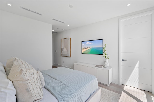 bedroom with light wood-type flooring