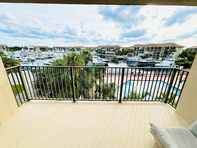 balcony featuring a water view