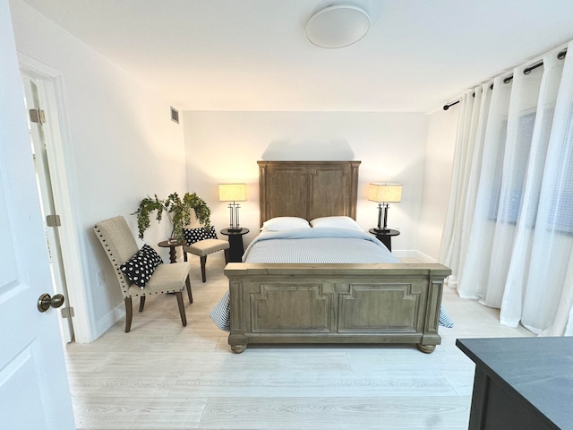 bedroom with light hardwood / wood-style floors