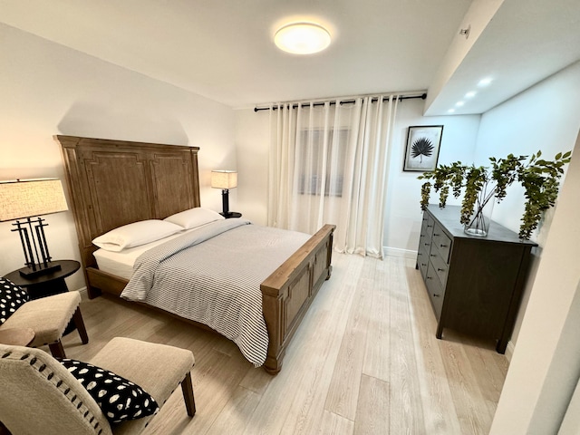 bedroom with light hardwood / wood-style floors