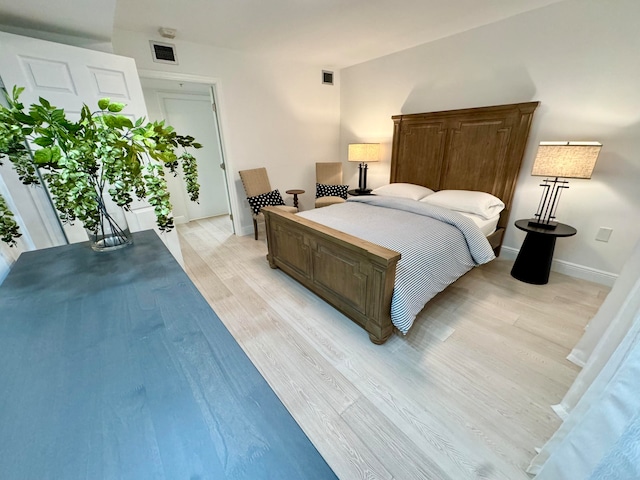 bedroom with light hardwood / wood-style floors