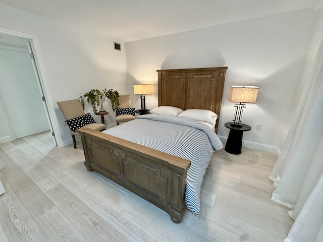 bedroom featuring light hardwood / wood-style floors