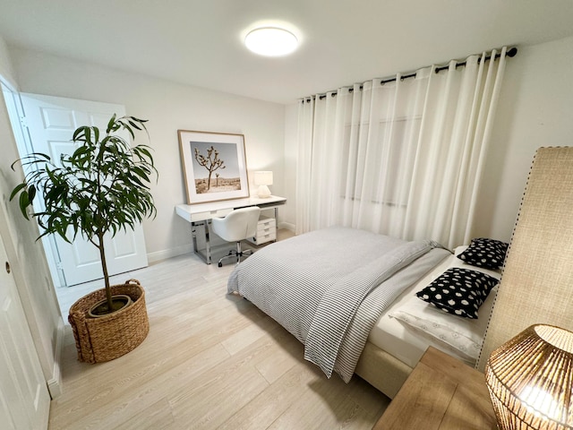 bedroom featuring light wood-type flooring