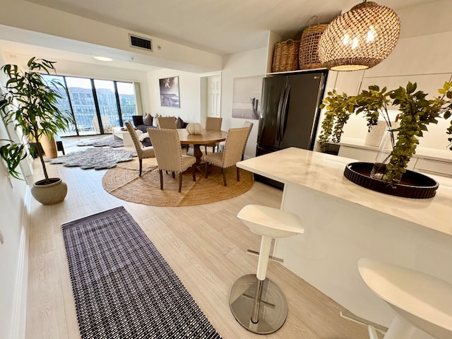 dining space featuring light hardwood / wood-style flooring