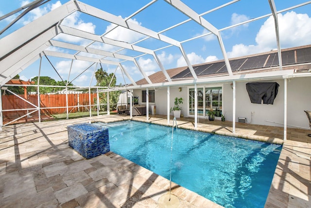 view of swimming pool with a lanai and a patio