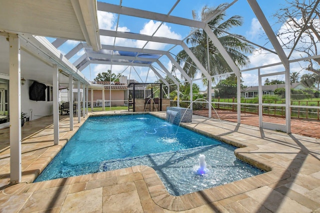 view of pool featuring a lanai, a patio, and pool water feature