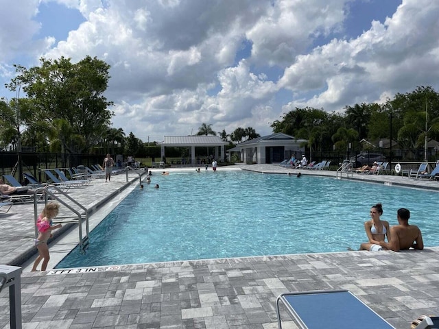 view of swimming pool with a patio area