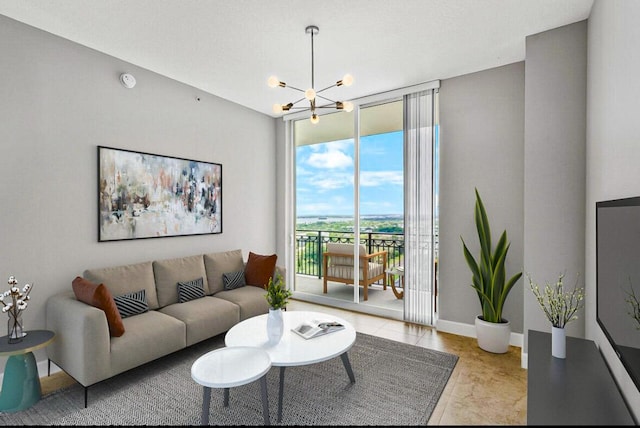 living room featuring a chandelier and a wall of windows