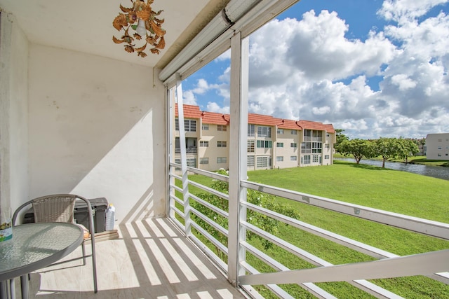 balcony featuring a water view