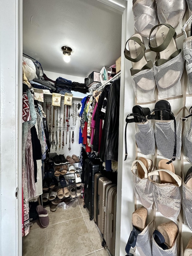 walk in closet featuring light tile patterned floors