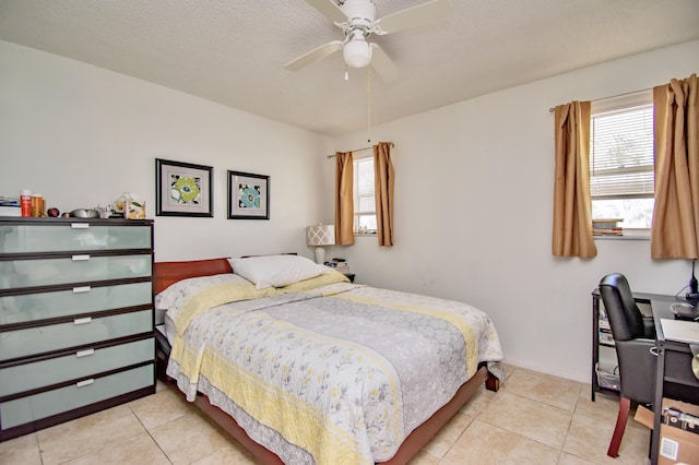 bedroom featuring light tile patterned floors, a textured ceiling, and a ceiling fan