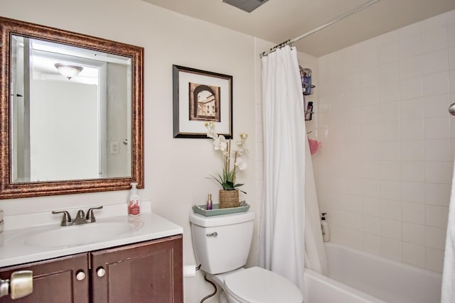 bathroom with shower / tub combo, vanity, and toilet