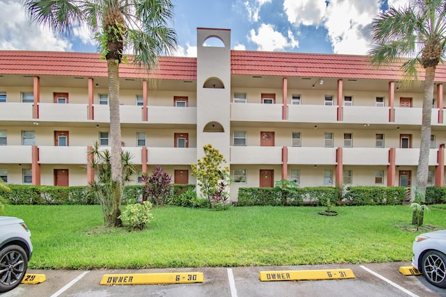 view of property with uncovered parking