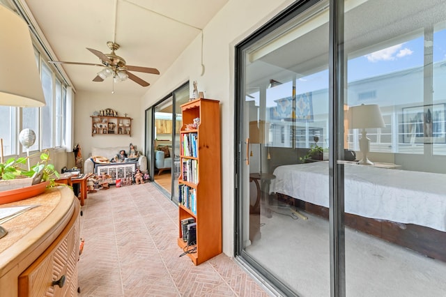 interior space featuring ceiling fan