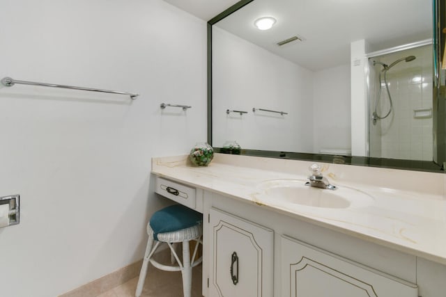 bathroom with vanity and a shower with door