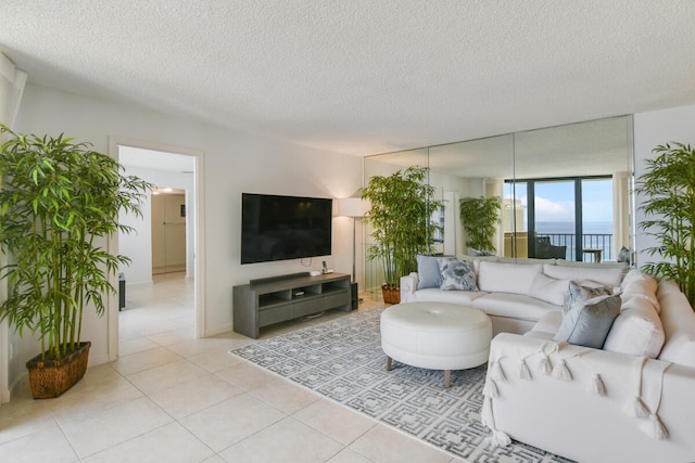 tiled living room with a textured ceiling