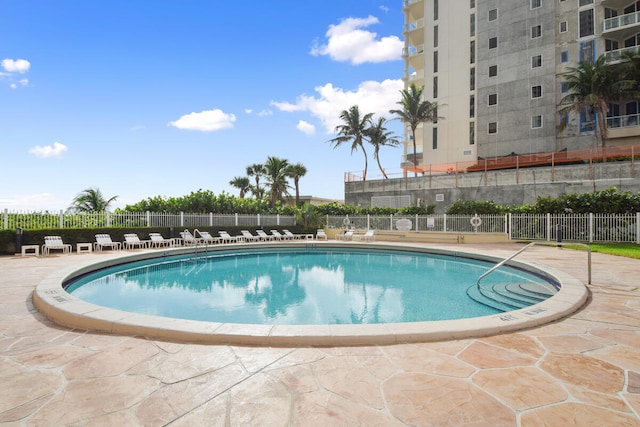 view of swimming pool with a patio area