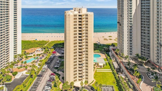 aerial view with a water view and a view of the beach