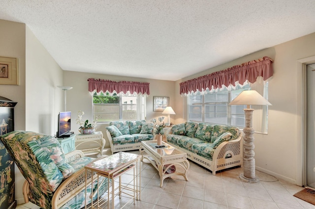 living room featuring light tile patterned floors and a textured ceiling