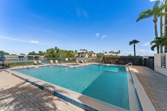 view of swimming pool featuring a patio area