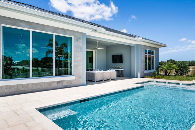 back of house with ceiling fan, outdoor lounge area, a fenced in pool, and a patio