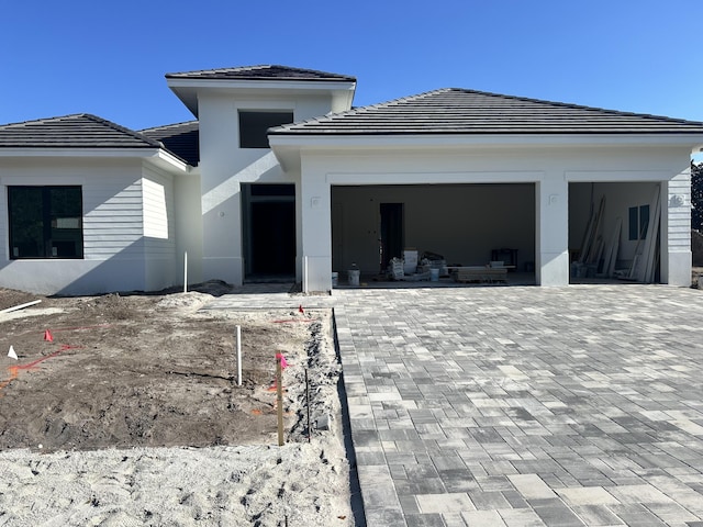 back of house featuring a garage