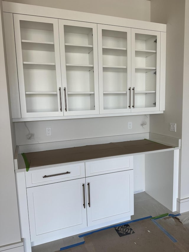 bar with white cabinetry