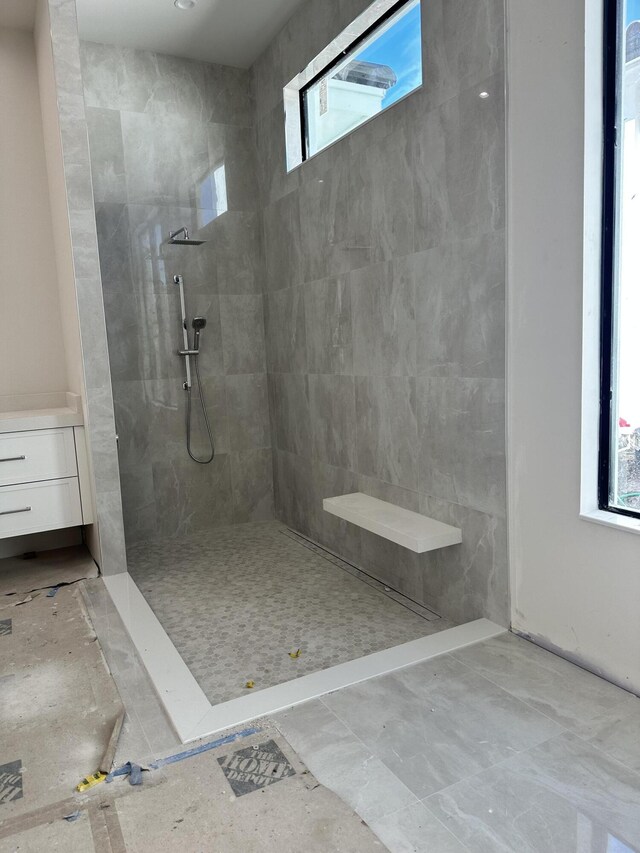 bathroom with tiled shower