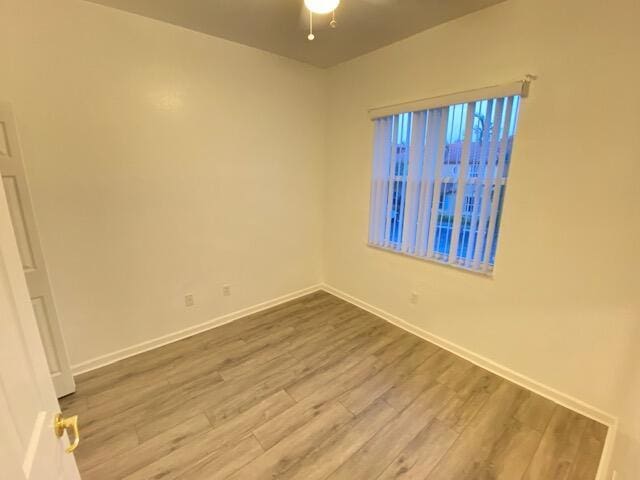 empty room featuring hardwood / wood-style flooring