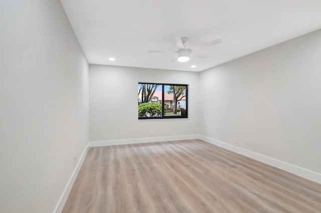 unfurnished room featuring ceiling fan and light hardwood / wood-style floors