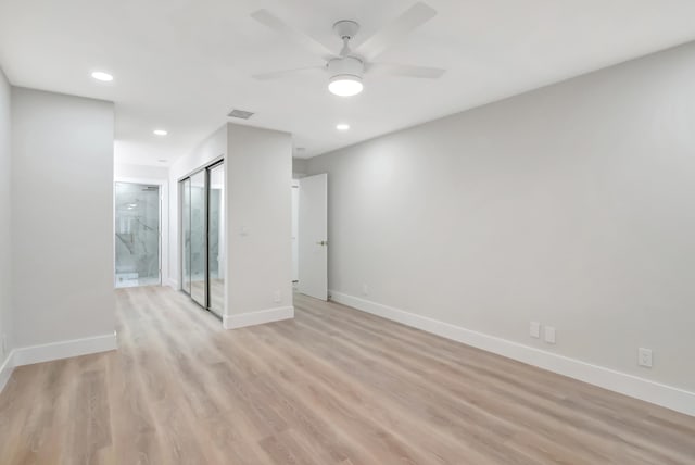 unfurnished room featuring ceiling fan and light hardwood / wood-style floors